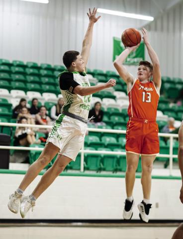 Rotan's Tucker McWilliams puts up shot over a Piper defender in the closing seconds of the Hammers' loss to Hamlin last Tuesday. PHOTO BY: MARK MARTINEZ