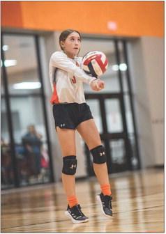 Lady Hammer Freshman Avery Gonzalez bumps up a ball during a game against Wellman-Union Tueday night. The Hammers played 4 matches against the Lady Cats, 7,8,JV &amp; V, with the 8th Grade and JV teams winning their games. Photo by Mark Martinez