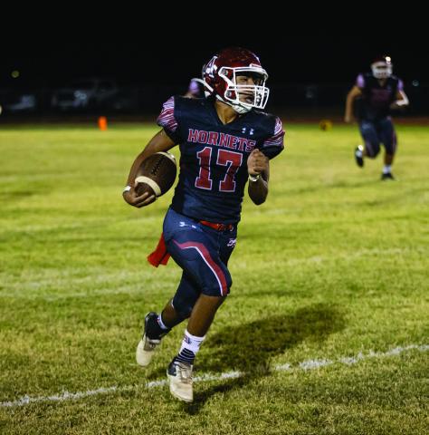 Hornet senior Calob Castaneda races down the sideline towards the endzone during last Friday's win over Guthrie.