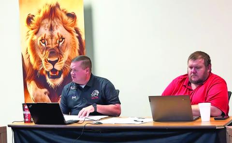 Superintendent Jimmy Bennett, seated beside Board President Kevin Kelly, updates the Roby CISD board on his recommendation to delay action on the Rock House demolition and outlines plans to invite financial advisor Jake Lawrence to return with additional information as the district monitors IREN-related developments.