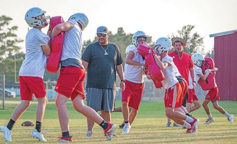 Roby CISD Coaches Johnny Sanchez(Left) and AD Matt Tarbutton(right) observe players' technique during a contact drill.