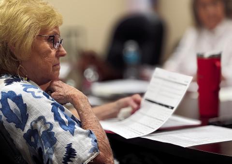 SMHD Board Secretary, Belinda Page listens attentively as the board reviews details of the proposed Swenson Solar Farm tax abatement agreement.