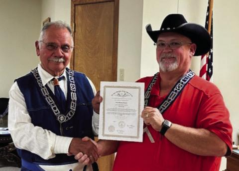 Brother Brooks receiving his award from the Worshipful Master Jay Hagins
