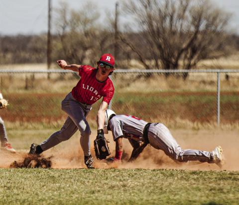 Roby's Kullen Daniel snags a throw to second during the Lion's tourney match with Iraan. PHOTO BY: MARK MARTINEZ