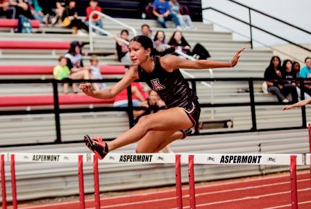 Aspermont’s Emilee Silva running the 100m Hurdles.