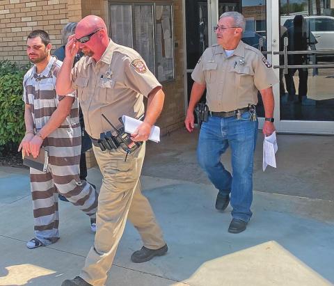 (Pictured Right) Fisher County Sheriff Randy Ford and Deputy Erick Reynolds escort Christopher Gonzales from the Fisher County Courthouse on Wednesday after his guilty plea and subsequent 12-year-sentence