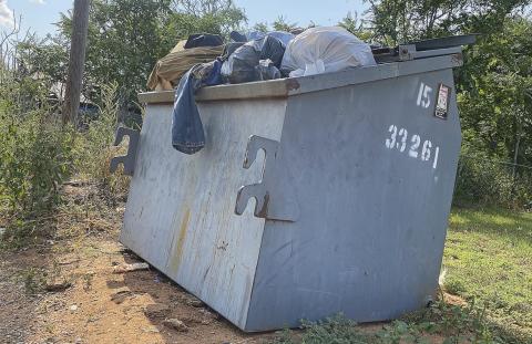 This dumpster, located near Richard St. in Rotan proper, is one of several that have been skpped multiple times and is overflowing with weeks worth of garbage.