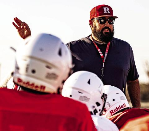 Zane Graves, newly appointed principal of Roby High School, speaks to student-athletes during football practice. Graves, known for his servantleadership style and deep roots in the district, now transitions from the field to the front office to lead the entire campus. PHOTO MARK MARTINEZ