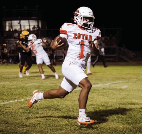 Left: Rotan's Chris Martinez zips toward the endzone during the Yellowhammers match with the Loraine Bulldogs last Friday.