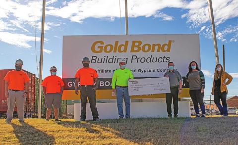 Brandon Hamptom, Casey Lester, Carlos Almanza, and Plant Manager Dale Miller present a $35,000 check to Rotan ISD Superintendent Greg Decker, Principal Jody Helms and Counselor Katrina Jarvis on Tuesday.