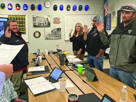 Roby CISD Superintendent Jason Carter sworn in new board member Michele Terry and returning board members, Kevin Kelley, and Dakota and Stormy Rasberry during Monday night's regular board meeting