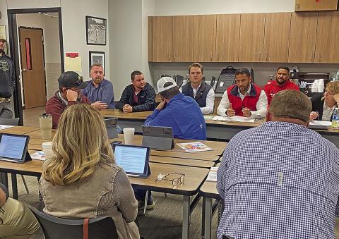 Representatives from WRA Architects and Gallagher Construction discuss with Roby CISD Trustees remaining troubled areas as the district's construction project nears completion.