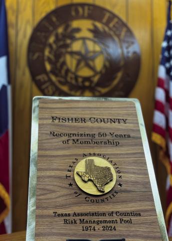 This commemorative plaque from The Texas Association of Counties was awarded in recognition of Fisher County's 50 years of service and dedication to one of the state's most influential county-led organizations.