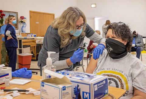 SMHD Clinic Coordinator Jan Harris administers the COVID vaccine to Jayton resident Lenora Stanaland during the vaccine clinic held at the Kent County Community Center on Tuesday, February 9, 2021