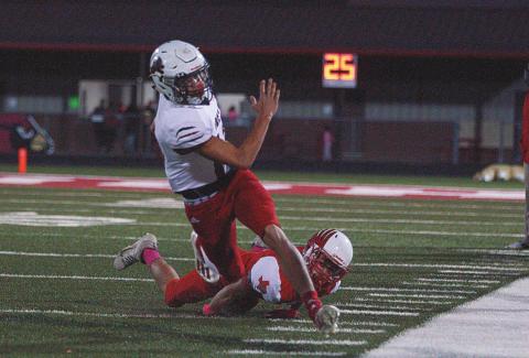 Senior, Gunner Helm maneuvers around a Hermleigh defender during his run towards the in zone.