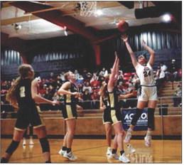 Above: Sophomore Keslie Criswell puts up a shot over Lady Jay defenders during the Aspermont Lady Hornets 46-34 win over Jayton just before Christmas break.