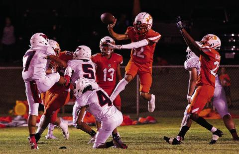 Rotan Freshman Jose Garza blocks Strawn's attempt for an extra point during Friday nights high scoring battle. The game, according to game announcer, was the 36th longest 6 man football game in Texas history. (Photo by Tricia Hurt)