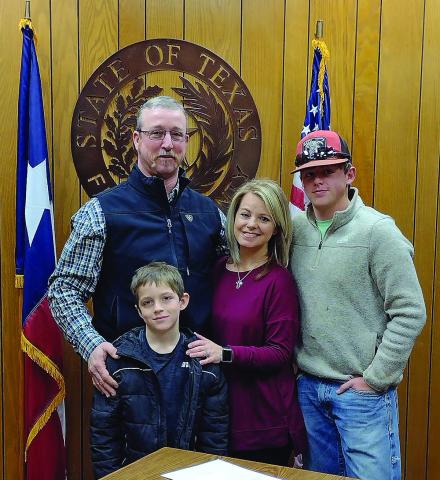 Commissioner Micah Evans, with his wife Melissa, sons Kaden Waldon and Carson Evans