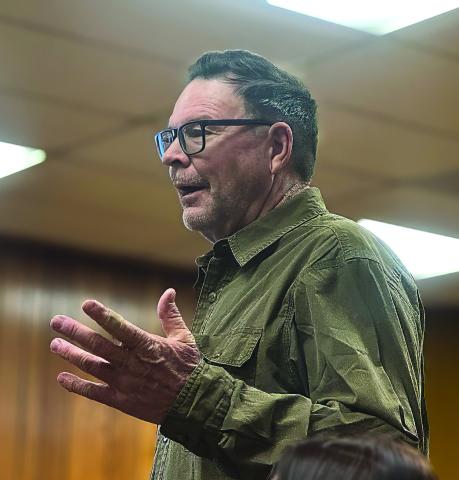 Local resident Kit Page addresses the Fisher County Commissioners Court during the February meeting, raising concerns about the proposed data center and renewable energy developments near his ranch south of Sylvester. Photo By JEFF HURT