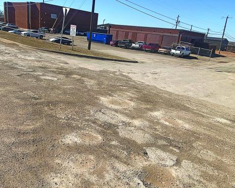 Potholes along Florence Avenue are temporarily mended until supply chains improve.