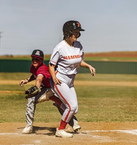 Rotan's Kayleigh Price dodges Aspermont pitcher Grayson English at home plate to score a run during the Hammers 18-5 win over the Hornets last Friday. PHOTO BY: MARK MARTINEZ