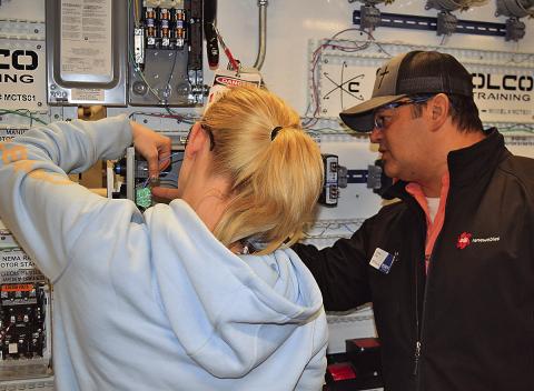 TSTC Industrial Systems instructor Daniel Diaz (right) works to make sure that students are prepared for a career while also taking the time to ensure that they have success in their lives. (Photo courtesy of TSTC.)