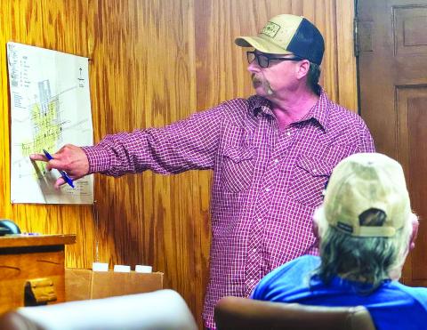 Roby City Manager Jack Brown points to troubled water delivery areas that are expected to be replaced should the city be awarded funding. PHOTO BY JEFF HURT