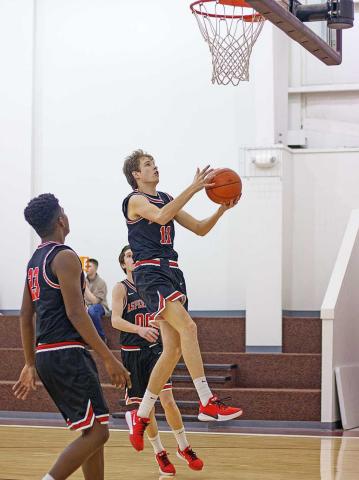 Aspermont Hornet Olen Johnson gets an easy layup in last Friday's gaem against Paint Creek. (Photo by Mark Martinez)
