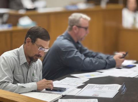 Fisher County commissioners Stuart Posey and Micah Evans double check calculations before adopting the county’s FY 2025–2026 budget