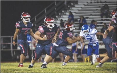 Aspermont Sophomore Tyler Kessinger recieves the hand off from teammate Caleb Broshears during the Hornets' 62-12 win over Rule last Friday night. PHOTO BY MARK MARTINEZ