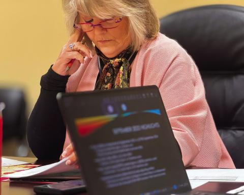 Stonewall Memorial Hospital District Board President Ellen Abernathy listens as CFO Lew Robbins presents the district’s September financial report during the board’s regular November meeting. PHOTO BY JEFF HURT