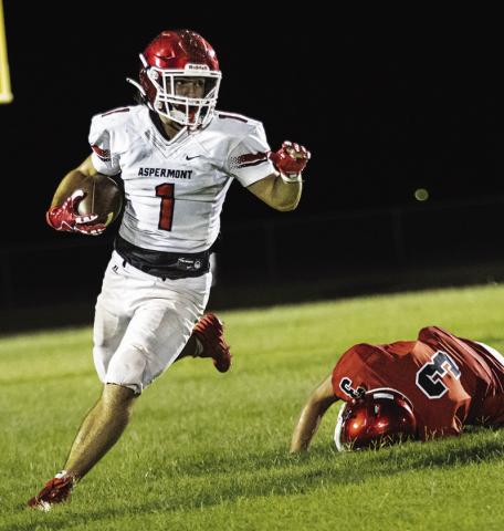 Sophomore Kolby Bradshaw eludes a tackle during the Hornets Midnight Madness intrasquad scrimmage last week. PHOTO BY MARK