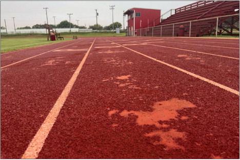 Experts say frigid December temperatures during installation is the likely culprit for deteriorating Roby CISD track after only three years. The repairs and two new layers of material Hellas Sports will install in July is expected to extend the track’s lifespan by years. PHOTO BY MARK MARTINEZ