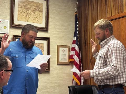 Mayor Zack Johnson administers the oath of office to James Tanner Park during a recent Rotan City Council meeting, swearing Park in to fill the vacant council seat left by Joy Dennis, who resigned while campaigning for Fisher