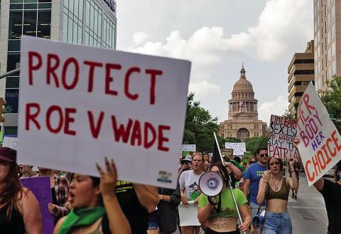 People rallying for abortion rights march down Congress Avenue in Austin on May 3, 2022. Credit: Lauren Witte/The Texas Tribune