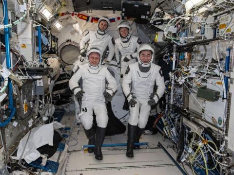 Four SpaceX Crew-11 members gather together for a crew portrait wearing their Dragon pressure suits during a suit verification check inside the International Space Station’s Kibo laboratory module. Clockwise from bottom left are, NASA astronaut Mike Fincke, Roscosmos cosmonaut Oleg Platonov, NASA astronaut Zena Cardman, and JAXA (Japan Aerospace Exploration Agency) astronaut Kimiya Yui. Credit: NASA