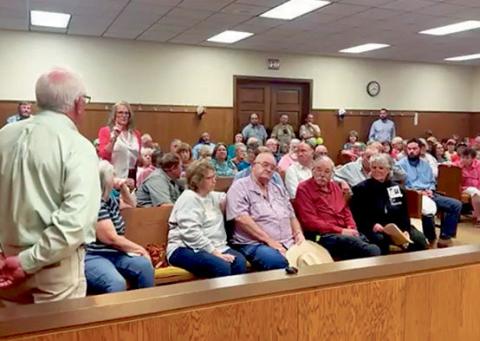 County officials, legal counsel, and company representatives share information and listen to public concerns during a public hearing held in April regarding Crusoe’s application for a reinvestment zone. PHOTO BY TRICIA HURT