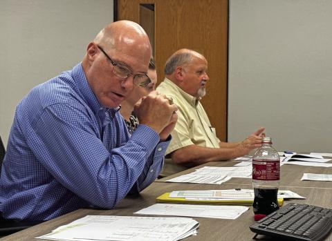 Tax appraisal experts Gary Zeitler and Rodney Kret speak to Rotan ISD officials, hoping to explain tax value fluctuations the district has experienced during recent years. PHOTO BY MARK