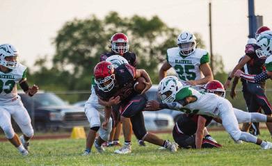 Aspermont senior Carson Guidry plows through Hornet defenders during their 30-14 season opener against Blackwell this past Friday. The Hornets will look to build a streak with a win against Southland this Friday night in Aspermont. PHOTO BY MARK MARTINEZ