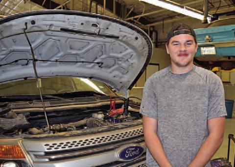 Photo caption: Bryce Block is using the skills he has learned in Automotive Technology at TSTC to work on his Chevrolet Camaro at home. (Photo courtesy of TSTC.)