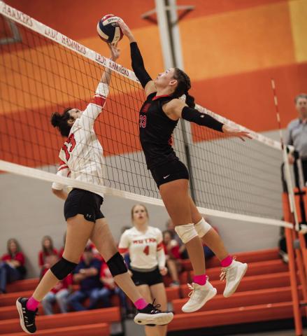 Aspermont's Addi Shugart (right) meets Rotan's Karlie Buchanan (left) at the top of the net during tuesday night's district matchup between the Lady Hornets and Lady Hammers. Aspermont would sweep Rotan in three hard fought games that came down to the wire. Photo by Mark Martinez