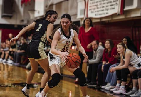 Aspermont sophomore Maleah Hecht weaves around a Lady Jay defender during the Lady Hornets' 31-35 loss to Jayton last Friday night. The loss to the Lady Jays evens up their series against each other at 1-1 in a fight for first place in district. They will travel to Hamlin this Friday night for a 2nd district bout with the Lady Pipers. Photo by: Mark Martinez