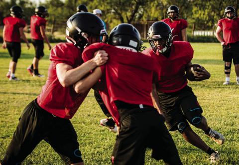 Junior Isaiah Johnson darts through a gap during Aspermont's morning practice. Photo by Mark Martinez.