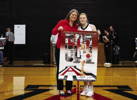 Aspermont Lady Hornet senior Matti Polk poses with Lady Hornet basketball head coach Tiffany Potts during a pregame celebration of Polk's career milestone 500 rebounds last Friday night in Aspermont. Photo by: Mark Martinez