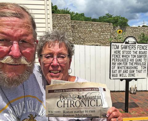 The Nomadic Newspaper says paintin' fences is fun!