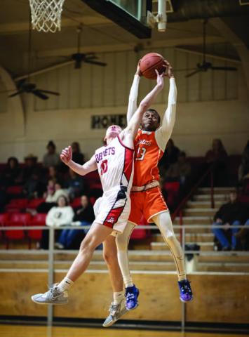 Rotan senior Jordan Daniel battles with Aspermont's Jasper Hope for a rebound during the Hammers' 50-78 loss the Hornets last Tuesday night. Photo by Tricia Hurt