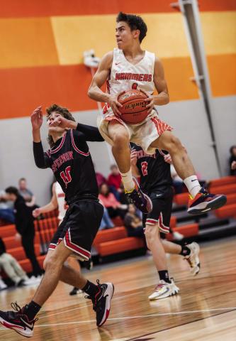 Rotan's Caleb Fortushniak goes airborne for a shot over a Hornet defender during the JV Hammers 24-19 win over Aspermont late last month. Photo by Mark Martinez