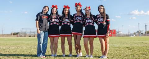 L-R: Mascot, Kailyn Shipp. Cheerleader L-R: Destiny Alaniz, Gemma Noell, Yessica Perez, Kassidy Daniel. Samarra Frausto. Not pictured: Keirstyn Pippin, Carly Jimenez. Photo by: Tricia Hurt