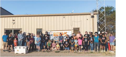 A small group of volunteers gathers early Saturday morning before heading out to their assignments during Rotan's first community-wide cleanup day. More than 140 volunteers ultimately participated in the effort, tackling projects across town and helping remove approximately 300 cubic yards of debris. PHOTO BY MARK MARTINEZ