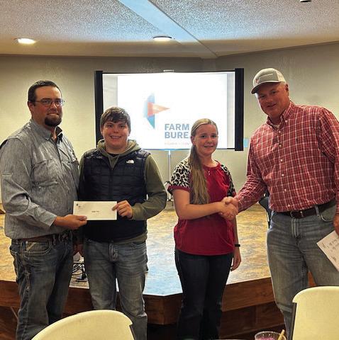 Roby FFA- left to right - Seth Kiker, Brycen Cole, Gemma Noell with FCFB president Steve Estes